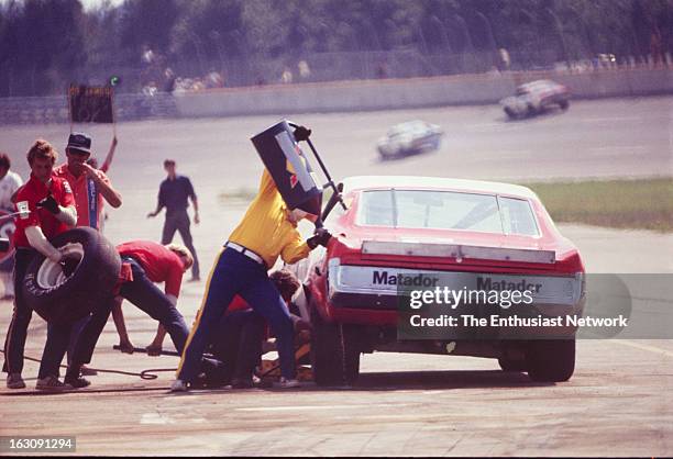 Yankee 400 NASCAR Race - Michigan International Speedway. Dave Marcis of Penske Racing comes into the pits for both fuel and tires in his AMC Matador.