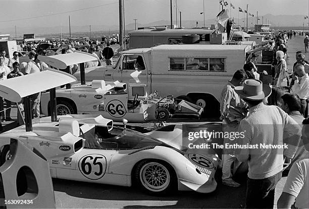 Stardust Grand Prix - Can-Am - Las Vegas. The Chaparral 2E of Phil Hill and Jim Hall draw a crowd of spectators in the paddock. The radical looking...