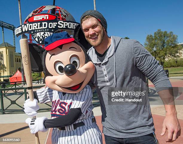 In this handout image provided by Disney Parks, reigning National League Rookie of the Year Bryce Harper of the Washington Nationals poses with...