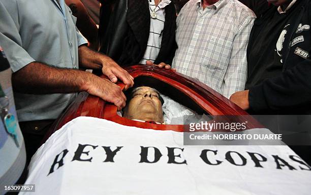 Fans of Paraguay's Olimpia footbal club pay their last respects to legendary Uruguayan footballer and coach Luis Cubilla, during his wake at the...