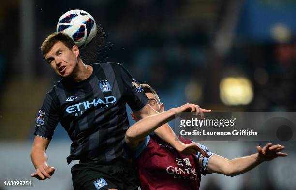 Edin Dzeko of Manchester City battles with Ciaran Clark of Aston Villa during the Barclays Premier League match between Aston Villa and Manchester...
