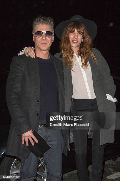 Etienne Daho and Lou Doillon arrive to attend the 'Saint Laurent' Fall/Winter 2013 Ready-to-Wear show as part of Paris Fashion Week on March 4, 2013...