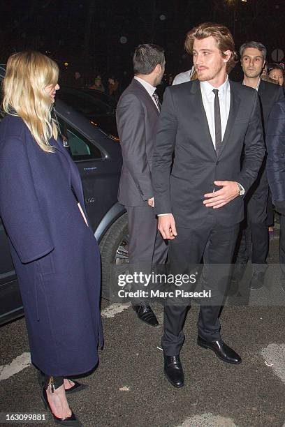 Actor Garrett Hedlund and actress Kirsten Dunst arrive to attend the 'Saint Laurent' Fall/Winter 2013 Ready-to-Wear show as part of Paris Fashion...