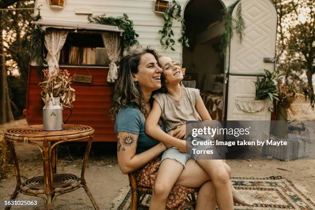 boy and mum sitting in front of a camper van - boy skirt stock pictures, royalty-free photos & images