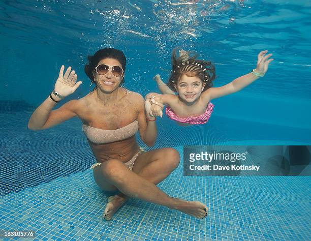 Teresa Giudice takes daughter Audriana Giudice for a swim at Majestic Resort on March 4, 2013 in Punta Cana, Dominican Republic.