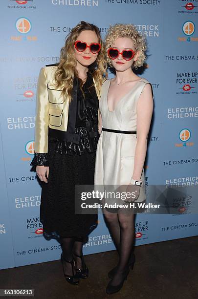 Acress Louisa Krause and Julia Garner attend The Cinema Society & Make Up For Ever screening of "Electrick Children" at IFC Center on March 4, 2013...