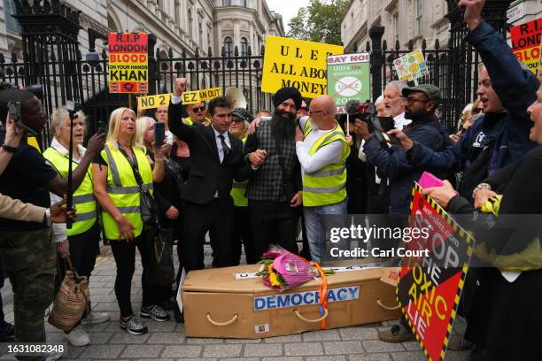 People protest against the Ultra Low Emission Zone expansion outside Downing Street on August 29, 2023 in London, England. The August 29 rollout of...