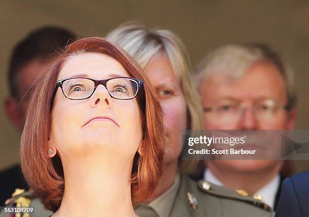 Prime Minister of Australia Julia Gillard and former Prime Minister of Australia Kevin Rudd look on as they leave the State Funeral for former...