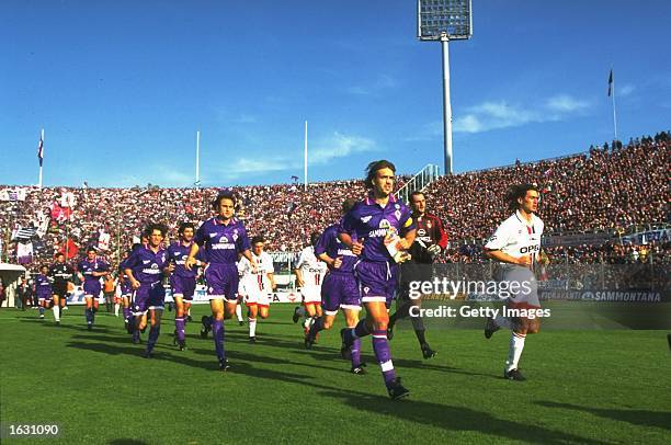 Gabriel Batistuta of Fiorentina and Paolo Maldini of AC Milan lead their teams onto the pitch before a Serie A match at the Artemio Franchi Stadium...