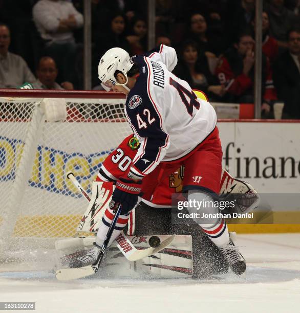 Ray Emery of the Chicago Blackhawks stops a shot by Artem Anisimov of the Columbus Blue Jackets at the United Center on March 1, 2013 in Chicago,...
