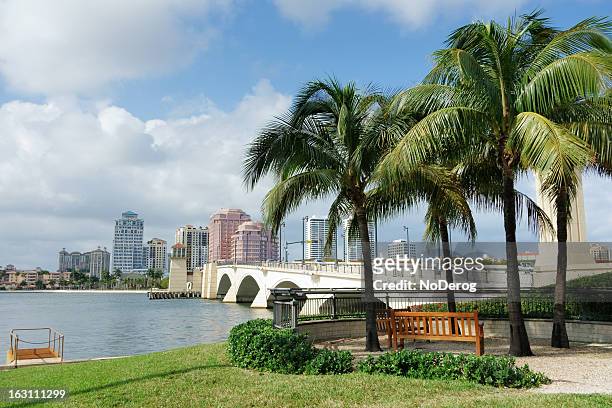 west palm beach cityscape viewed across intracoastal waterway - west palm beach stock pictures, royalty-free photos & images