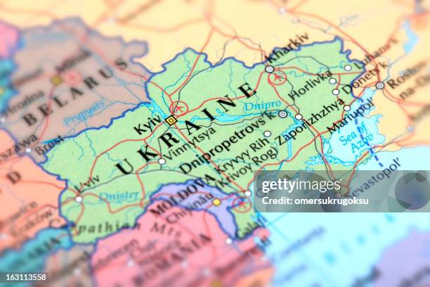 map of green ukraine on a globe - eastern europe stock pictures, royalty-free photos & images