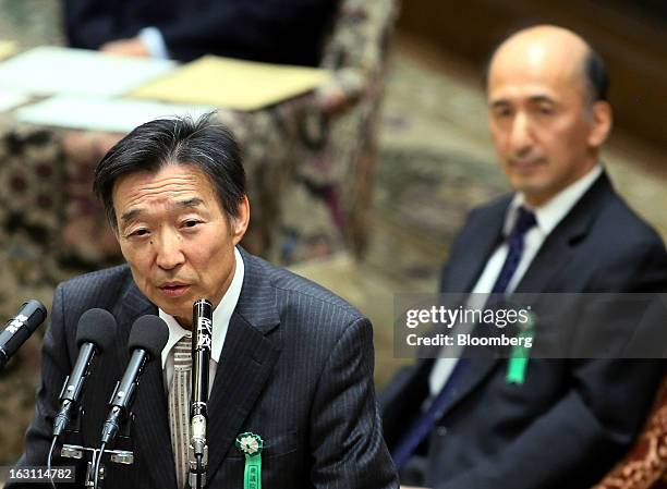 Kikuo Iwata, professor of economics at Gakushuin University and nominee for deputy governor of the Bank of Japan , left, speaks as Hiroshi Nakaso,...