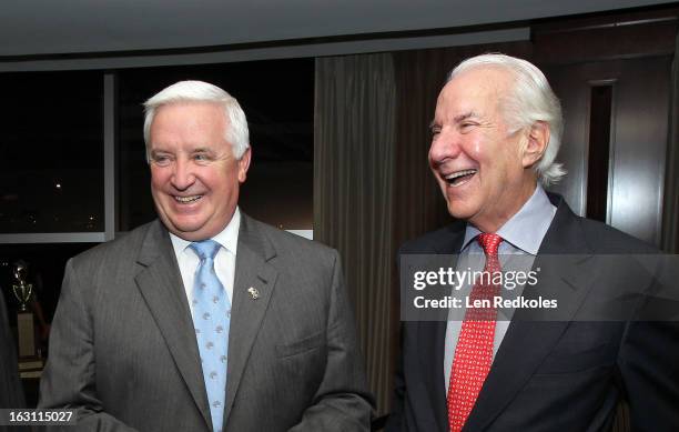 Chairman Ed Snider of the Philadelphia Flyers shares a laugh with Pennsylvania Gov. Tom Corbett prior to a NHL against the Washington Capitals on...