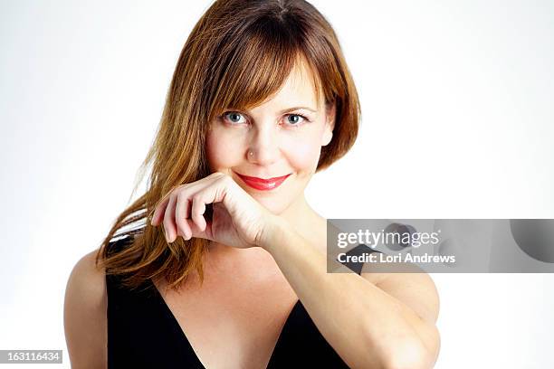 woman smiling with brown hair & red lips - red lipstick stock pictures, royalty-free photos & images