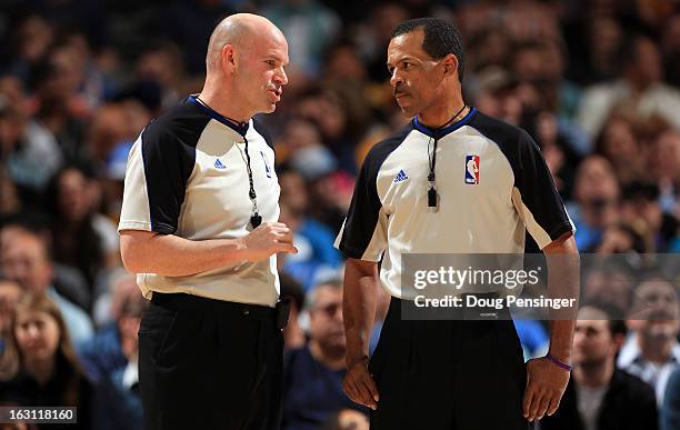 Referee Gary Zielinski and referee Eric Lewis talk during a break in the action as the Oklahoma City Thunder face the Denver Nuggets at the Pepsi...