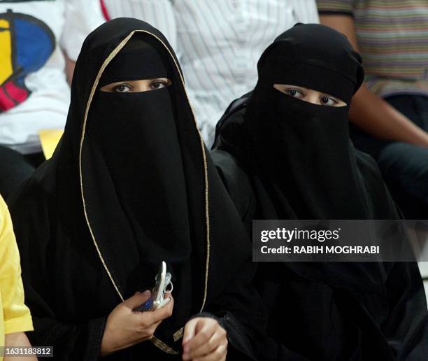 Emirati women wear the traditional traditional abaya, the long black robes worn by women in the Muslim Gulf region, along with the "shaila", or large...