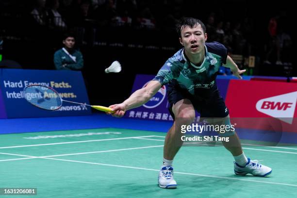 Wang Tzu Wei of Chinese Taipei competes in the Men's Singles Second Round match against Lu Guangzu of China on day two of the BWF World Championships...