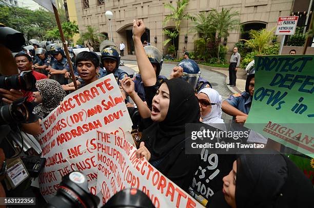 Protestors hold a rally outside the Malaysian embassy in the financial district of Makati on March 5, 2013 in Manila, Philippines. The protestors...