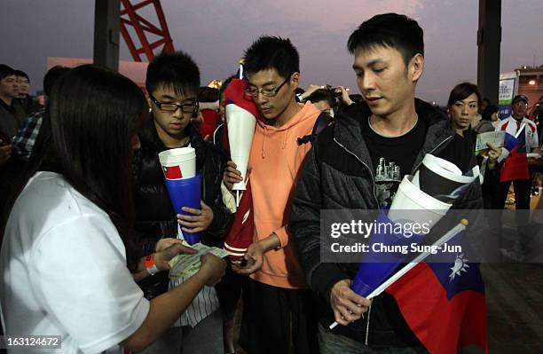 Taiwan fans enter the stadium before the World Baseball Classic First Round Group B match between Chinese Taipei and South Korea at Intercontinental...