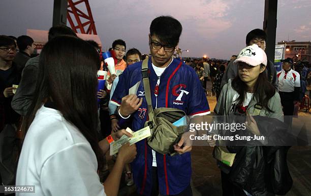 Taiwan fans enter the stadium before the World Baseball Classic First Round Group B match between Chinese Taipei and South Korea at Intercontinental...