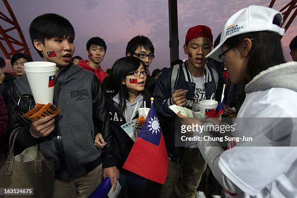 Taiwan fans enter the stadium before the World Baseball Classic First Round Group B match between Chinese Taipei and South Korea at Intercontinental...