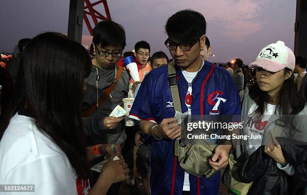 Taiwan fans enter the stadium before the World Baseball Classic First Round Group B match between Chinese Taipei and South Korea at Intercontinental...