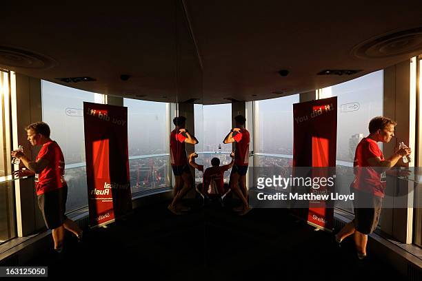 Runners look out the window after reaching the finish of the Vertical Rush event in the Tower 42 skyscraper on March 5, 2013 in London, England. More...