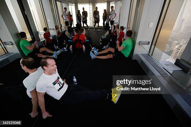 Runners relax after reaching the finish of the Vertical Rush event in the Tower 42 skyscraper on March 5, 2013 in London, England. More than a...
