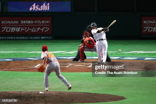 Outfielder Sho Nakata hits a RBI single in the bottom of the second inning during the World Baseball Classic First Round Group A game between Japan...