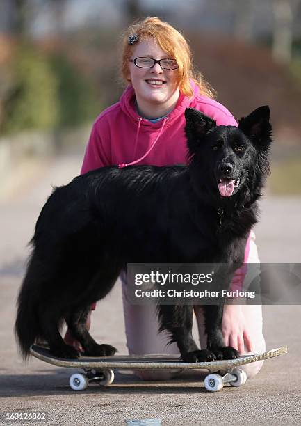 Twelve-year-old Abbie Reynolds Dobson and her dog Marley, a cross German Shepherd/Border Collie, pose for photographers as they practice their heel...