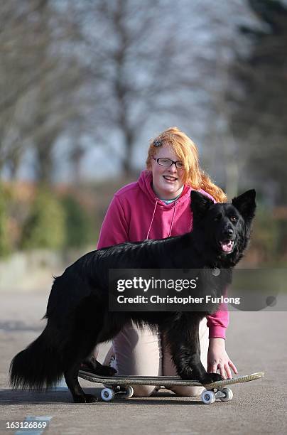 Twelve-year-old Abbie Reynolds Dobson and her dog Marley, a cross German Shepherd/Border Collie, pose for photographers as they practice their heel...