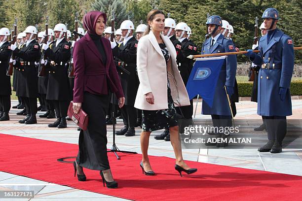 Jordan's Queen Rania and Turkish Hayrunnisa Gul pass by an honor guard during a welcoming ceremony of Jordan's king by Turkey's president at the...