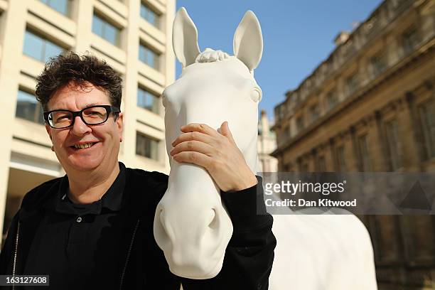 Artist Mark Wallinger poses beside his new sculpture 'The White Horse' outside the headquarters of The British Council on the Mall on March 5, 2013...