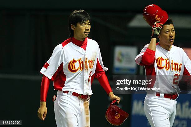 Outfielder Xiao Cui of China celebrates after scoring during the World Baseball Classic First Round Group A game between China and Brazil at Fukuoka...