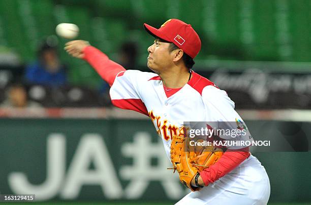 China's pitcher Lu Jiangang throws the ball against Brazil during the eighth inning of their first-round Pool A game in the World Baseball Classic...