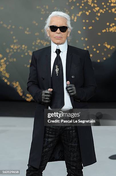 Fashion designer Karl Lagerfeld acknowledges applause following Chanel Fall/Winter 2013 Ready-to-Wear show as part of Paris Fashion Week at Grand...