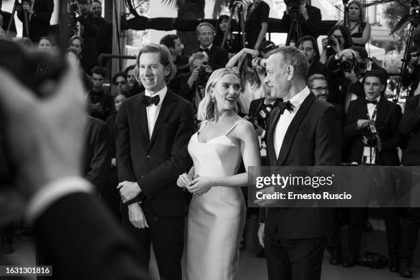 Director Wes Anderson, Scarlett Johansson and Tom Hanks attends the "Asteroid City" red carpet during the 76th annual Cannes film festival at Palais...