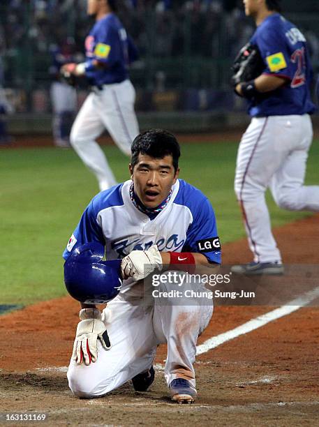 Jeong Keun-Woo of South Korea reacts after being tagged out on the home base in the fifth inning during the World Baseball Classic First Round Group...