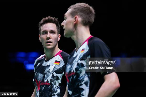 Mark Lamsfuss and Marvin Seidel of Germany react in the Men's Doubles First Round match against Christo Popov and Toma Junior Popov of France on day...