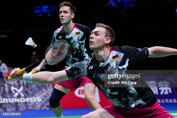 Mark Lamsfuss and Marvin Seidel of Germany compete in the Men's Doubles First Round match against Christo Popov and Toma Junior Popov of France on...