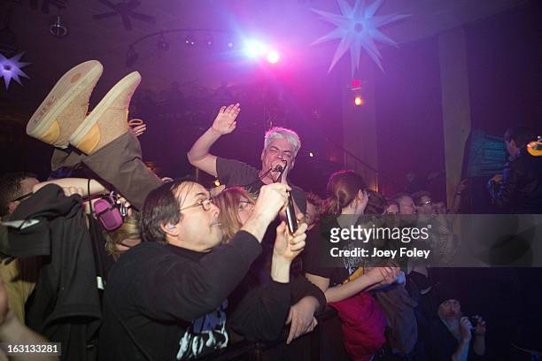Lead singer Paul Mahern of Zero Boys goes crowd surfing as his band performs onstage in concert at The Vogue on March 4, 2013 in Indianapolis,...