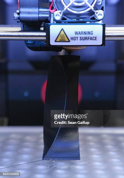 MakerBot 3D printer creates an object from molten plastic at the 2013 CeBIT technology trade fair on March 5, 2013 in Hanover, Germany. CeBIT will be...