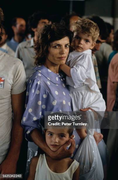 Albanian refugees disembarking a ship upon arrival in Brindisi, Italy, 1990.