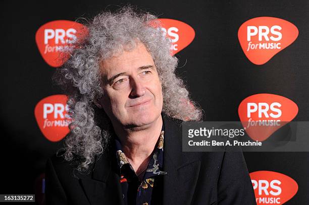 Brian May attends a photocall as Queen are awarded The Heritage award at Imperial College London on March 5, 2013 in London, England.