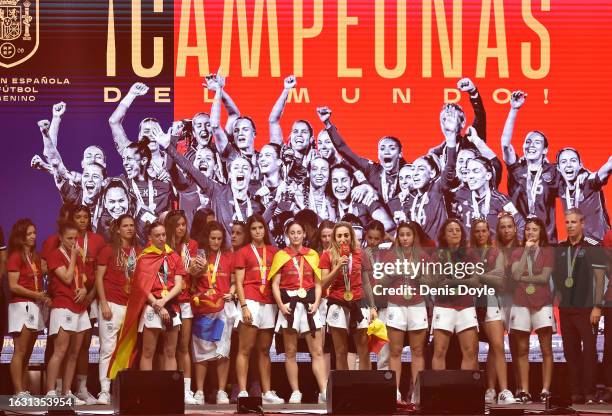 Olga Carmona of Spain addresses fans beside her teammates during the victory party for the Spain women's football team after they won the FIFA...