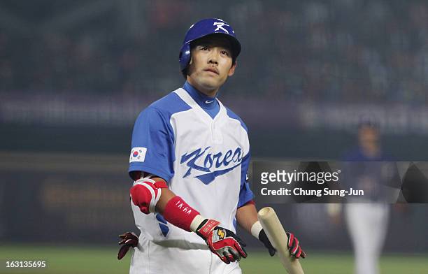 Lee Yong-Kyu of South Korea reacts after striking out in the fourth inning during the World Baseball Classic First Round Group B match between...
