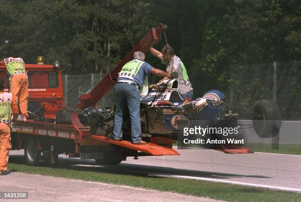 Ayrton Senna's Williams Renault is hauled off the circuit after Senna crashed during the San Marino Grand Prix at the Imola circuit in San Marino....