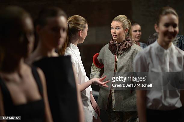Models prepare backstage before taking part in the Glasgow School of Art Fashion show on March 5, 2013 in Glasgow, Scotland. Third year textiles and...