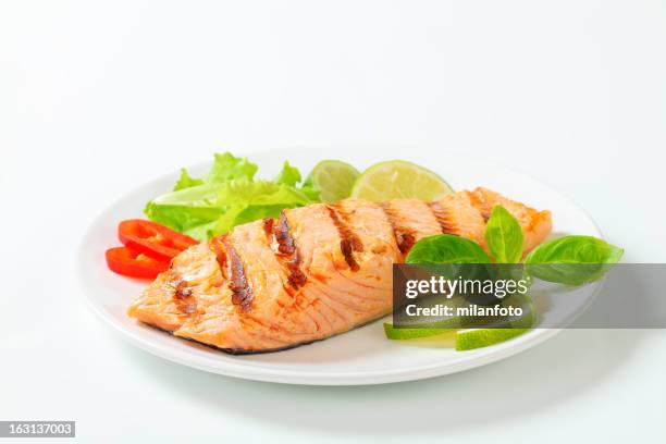grilled salmon steak on a plate - salmon steak stock pictures, royalty-free photos & images